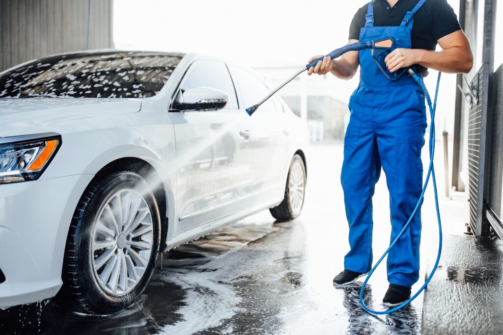 dreomis-professional-washer-blue-uniform-washing-luxury-car-with-water-gun-open-air-car-wash-ottawa